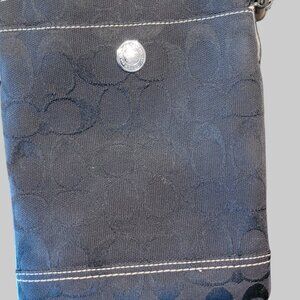 Coach black crossbody small purse with removable strap.